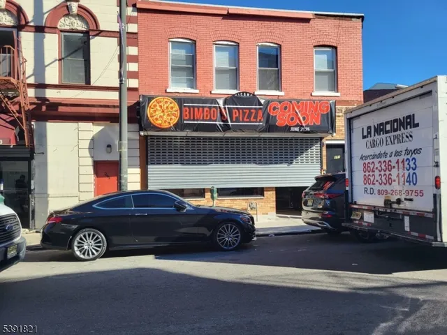a front view of a house with parking space