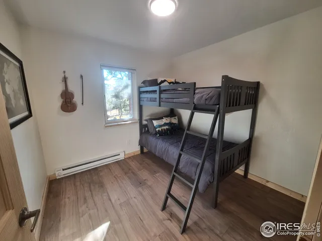 a view of workspace with furniture and wooden floor