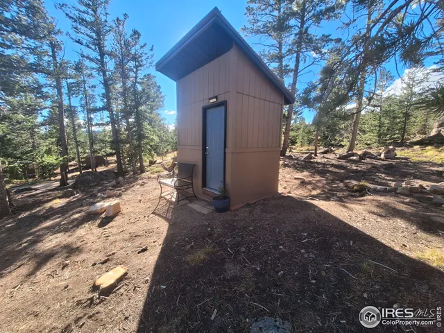 a pathway of a house with a yard