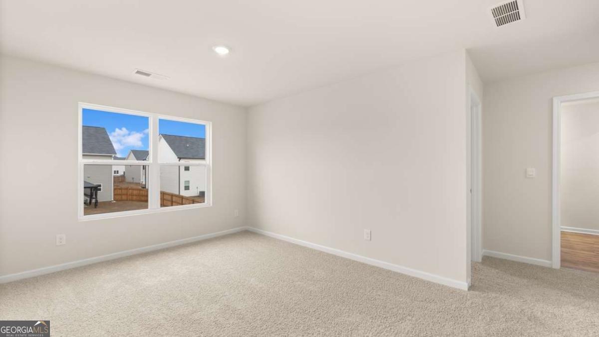 202 Cattle Drive Perry, GA 31069 - Photo 24 of 30 an empty room with a window