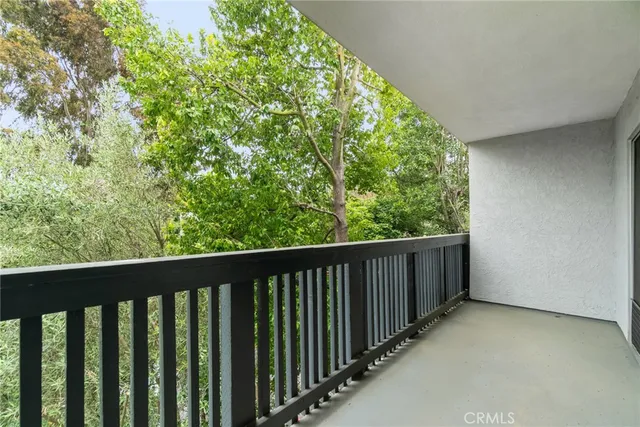 a view of balcony with yard