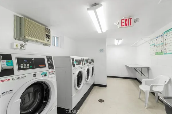 a bathroom with a sink a washer and dryer