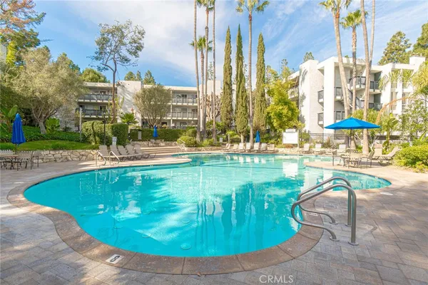 a view of a swimming pool with a patio