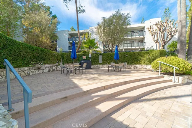 a building exterior with tall trees