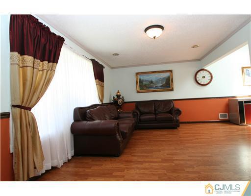 8 Moryan Road Edison, NJ 08817 - Photo 3 of 24 a living room with furniture