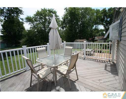 8 Moryan Road Edison, NJ 08817 - Photo 8 of 24 a view of a patio with a table