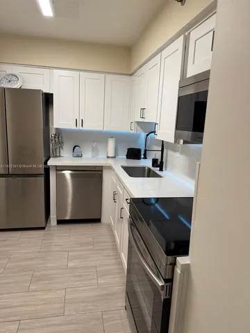 a view of workspace with wooden floor