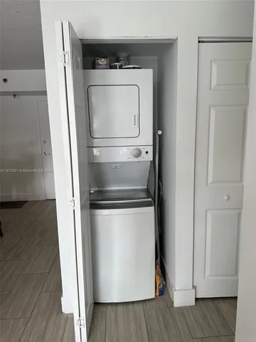 a view of a workspace with furniture and a gate