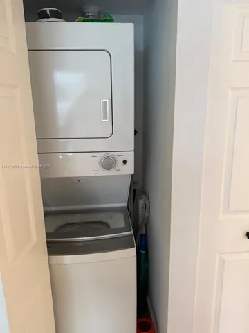 a bedroom with a bed and a mirror