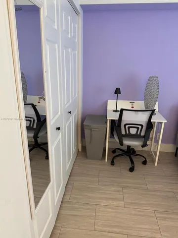 a white toilet sitting next to a bath tub and a shower