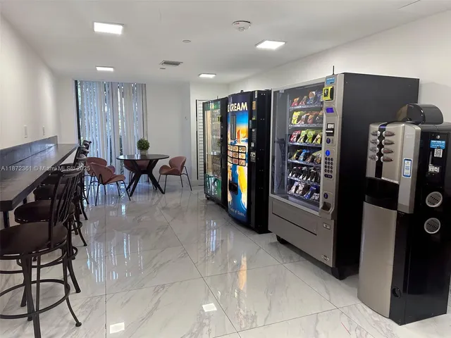 a view of a hallway with a chandelier