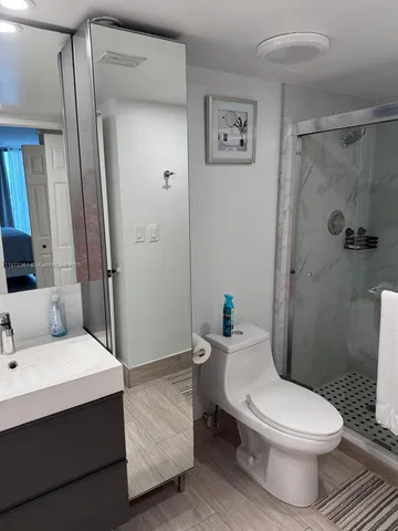 a bathroom with a sink and mirror