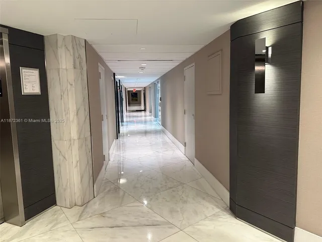 a view of a town with large trees