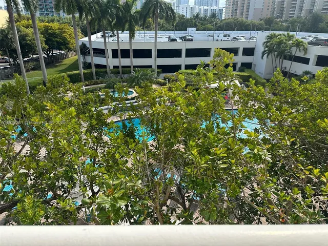 a view of a building with a yard