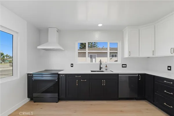 a kitchen with a sink and a stove