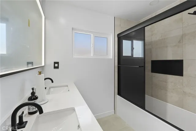 a bathroom with a bathtub and a sink