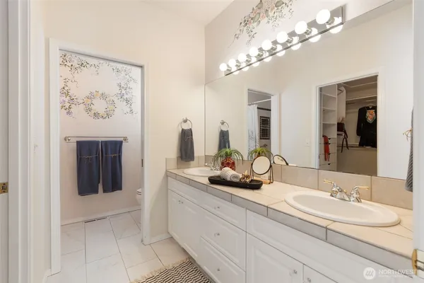 a bathroom with a toilet and a shower curtain