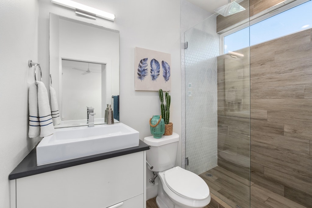 2909 East 13th Street, Unit 2 Austin, TX 78702 - Photo 18 of 23 Full bathroom featuring a walk in shower and vanity