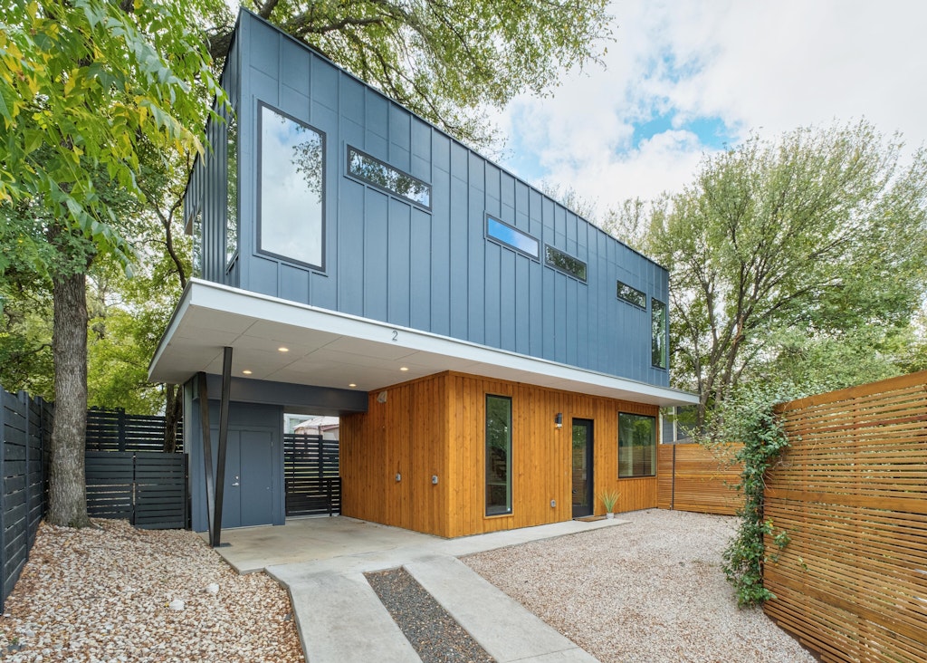 2909 East 13th Street, Unit 2 Austin, TX 78702 - Photo 2 of 23 View of building exterior featuring a fenced backyard