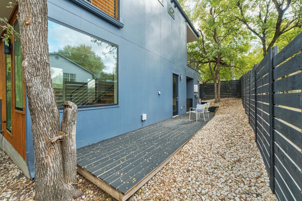 2909 East 13th Street, Unit 2 Austin, TX 78702 - Photo 21 of 23 View of side of home featuring a fenced backyard