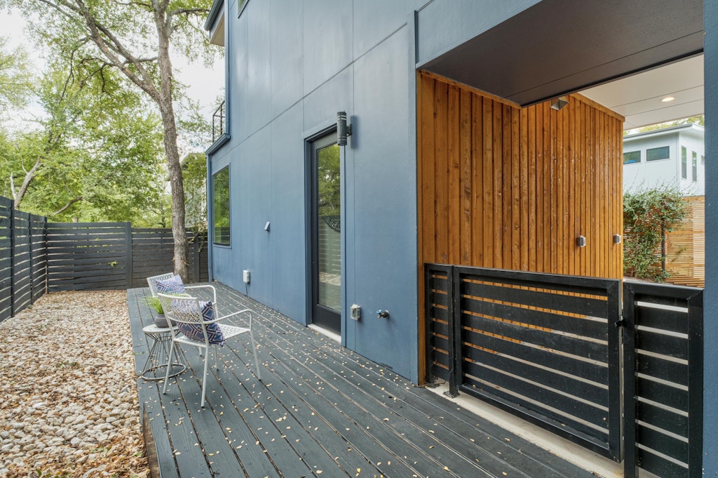 2909 East 13th Street, Unit 2 Austin, TX 78702 - Photo 22 of 23 Wooden terrace featuring a fenced backyard