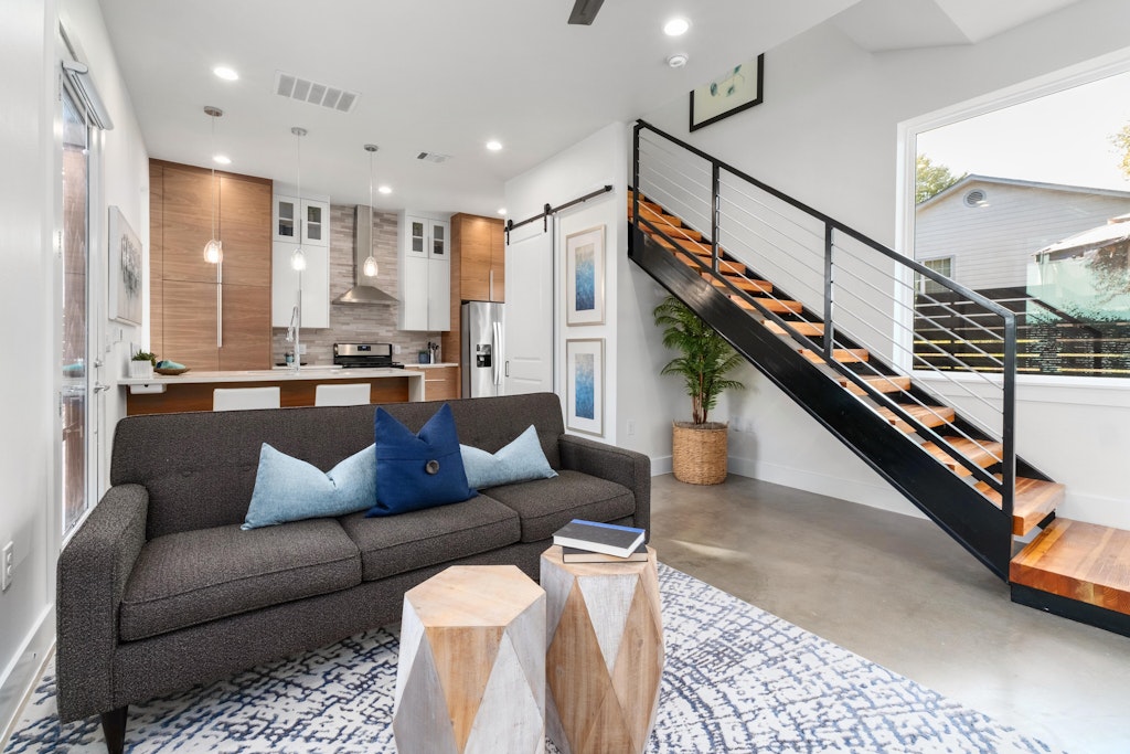 2909 East 13th Street, Unit 2 Austin, TX 78702 - Photo 6 of 23 Living area featuring a barn door, finished concrete floors, and recessed lighting