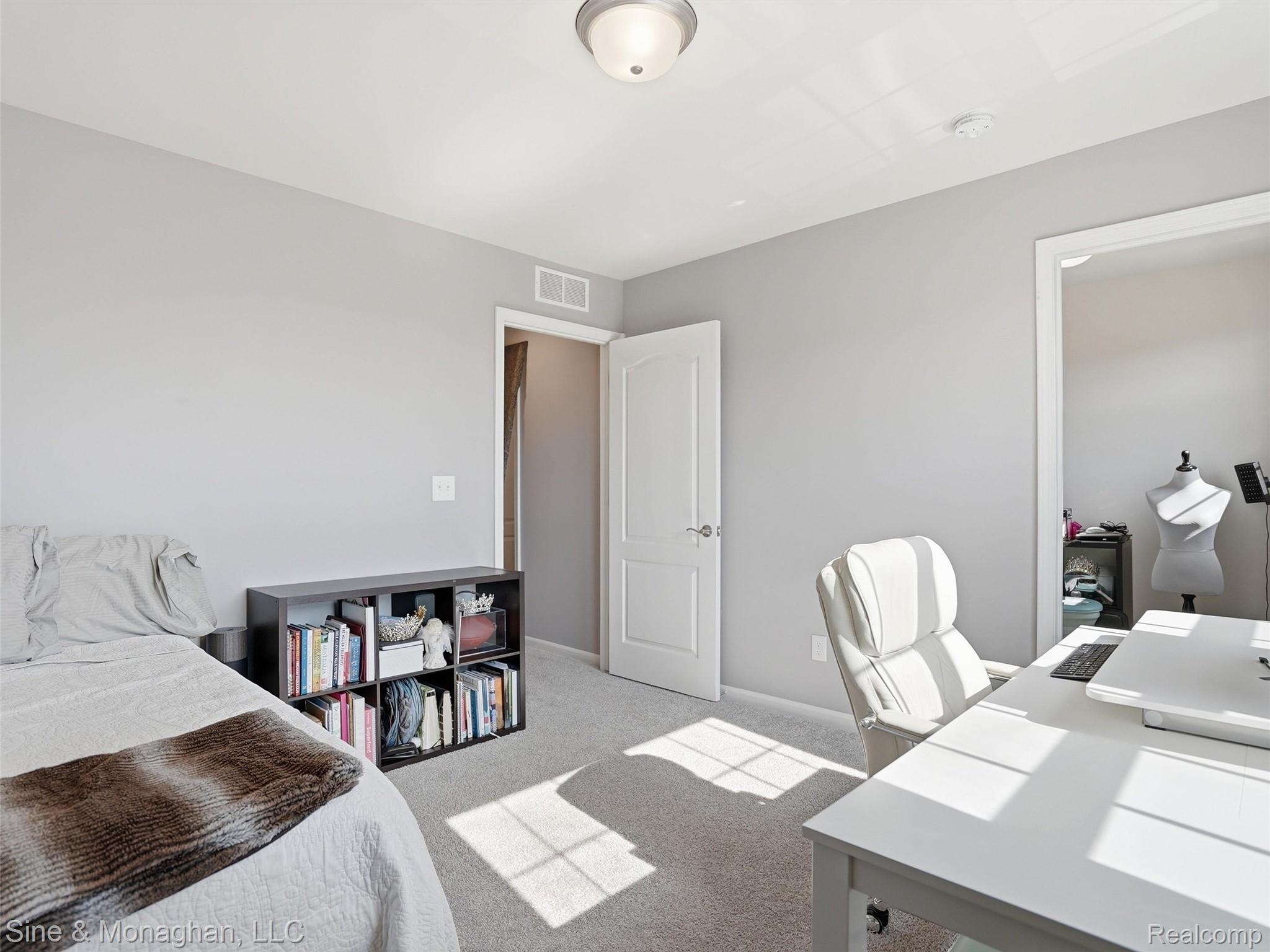 24827 Ivy Road Novi, MI 48375 - Photo 26 of 38 Interior room featuring light gray wall paint, off-white trim, and textured carpeting