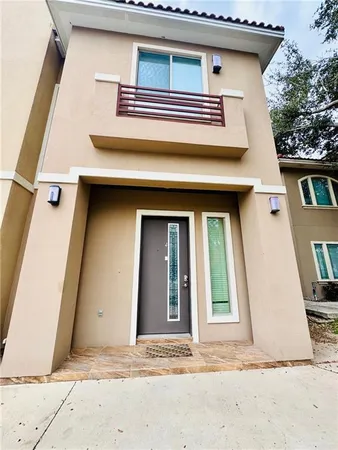 a view of a house with a door and a window