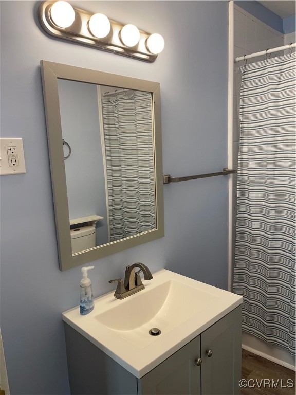 20020 Frog Level Road Ruther Glen, VA 22546 - Photo 19 of 32 Bathroom with vanity, hardwood / wood-style floori