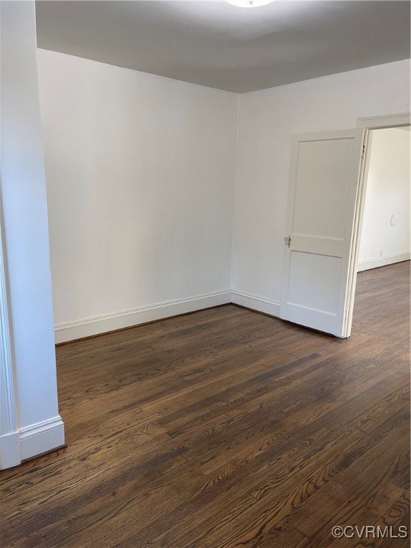 20020 Frog Level Road Ruther Glen, VA 22546 - Photo 3 of 32 Spare room with dark wood-type flooring