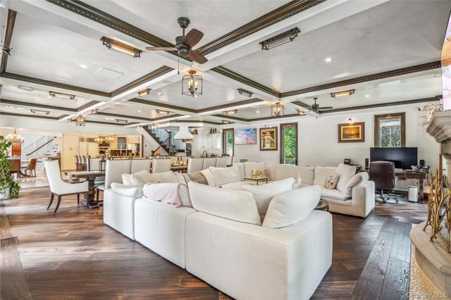 a living room with lots of furniture and white walls