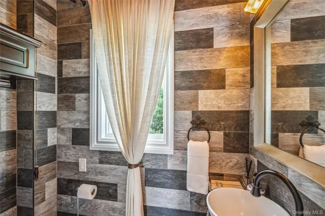 a front view of a house with outdoor seating