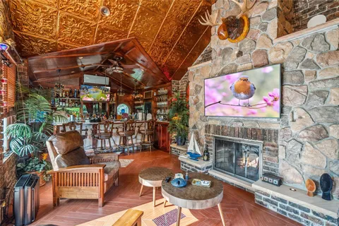 a outdoor living space with furniture and a fireplace