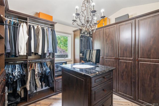 a view of a refrigerator and window in a room