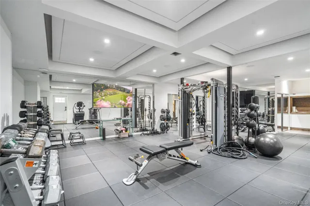 a living room with lots of gym equipment