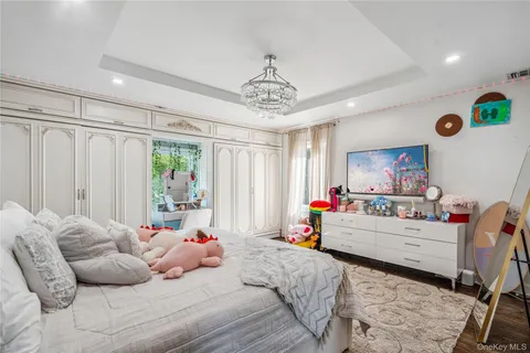 a bedroom with furniture and a window