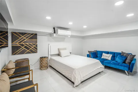 a bedroom with a bed and couch