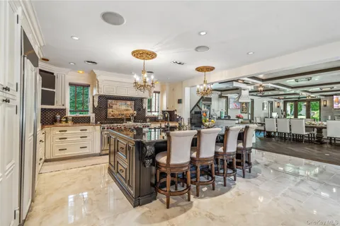 a kitchen with lots of counter space and furniture
