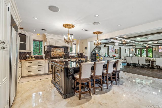a kitchen with lots of counter space and furniture