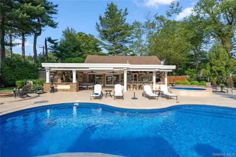 a front view of house with yard and outdoor seating