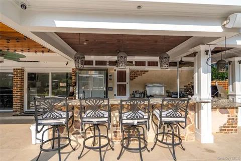 an outdoor view of a building with seating space