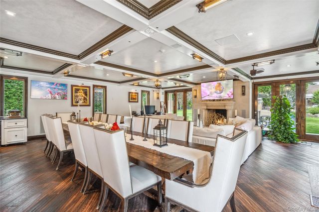 a living room with furniture a fireplace and a table