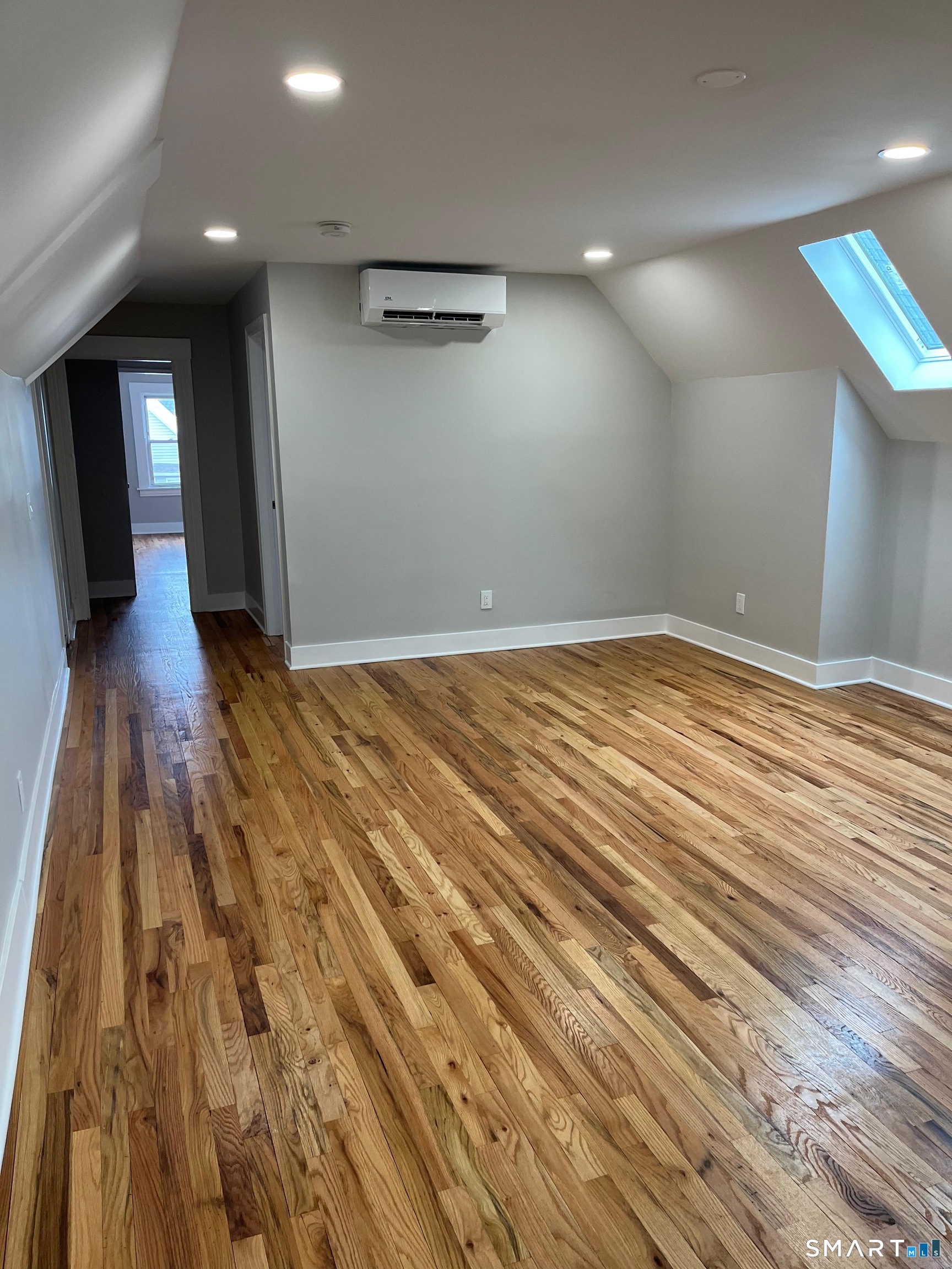 85 James Street, Unit 3 Bridgeport, CT 06604 - Photo 5 of 8 a view of empty room with wooden floor