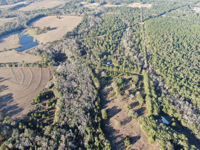 an aerial view of a houses with a outdoor space