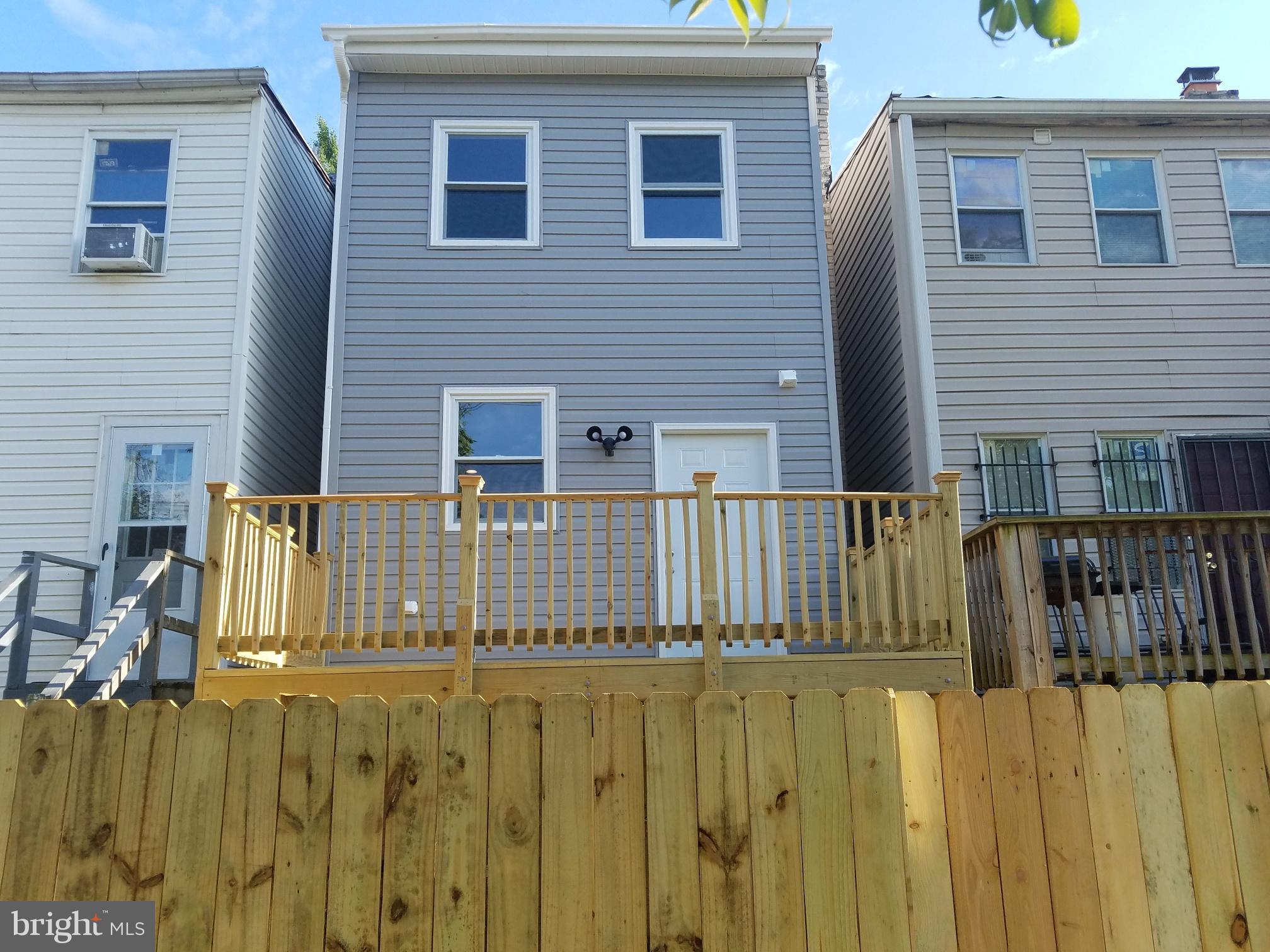 1322 Ridge Place Southeast Washington, DC 20020 - Photo 2 of 23 a view of a house with a wooden fence