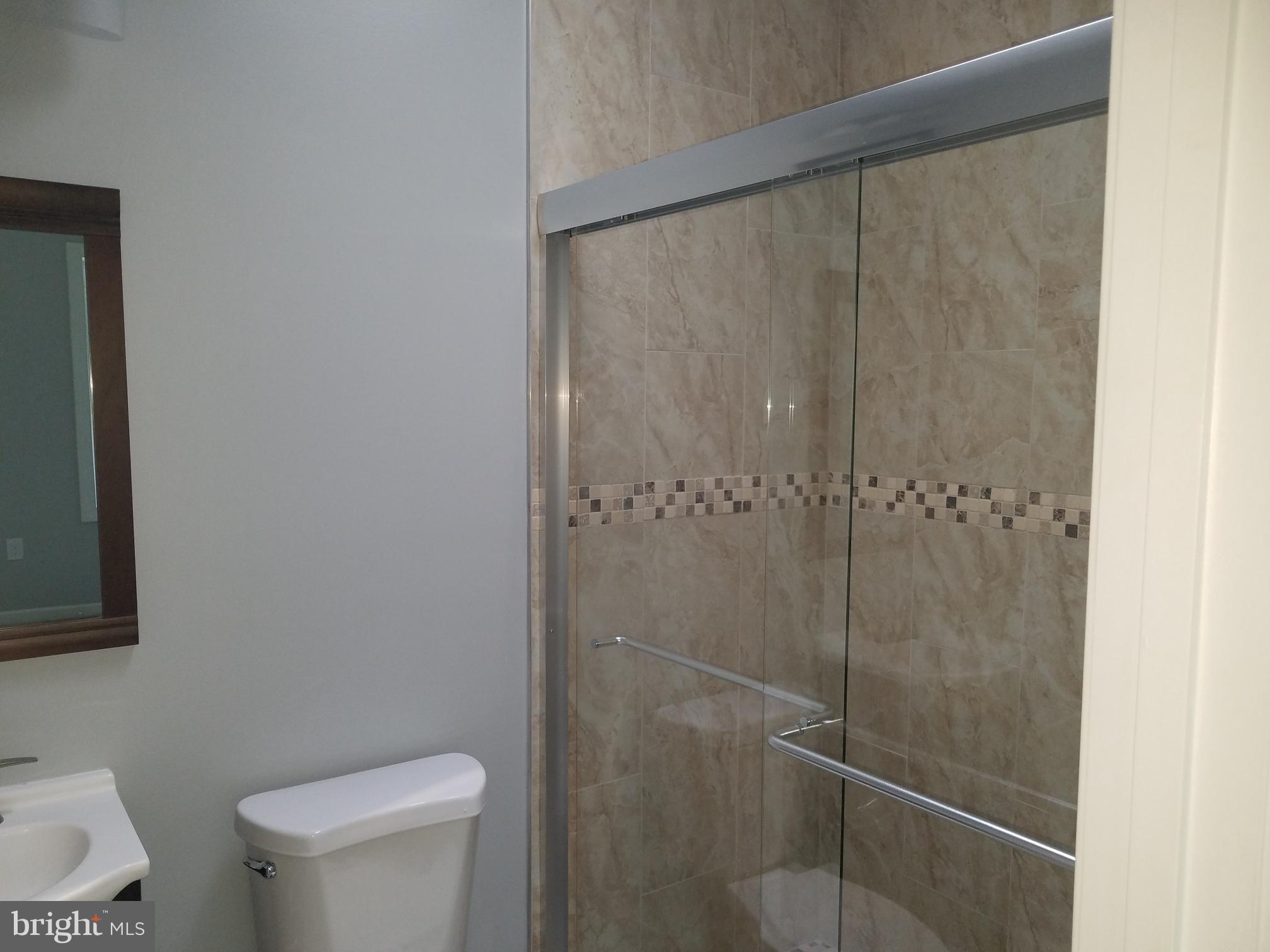 1322 Ridge Place Southeast Washington, DC 20020 - Photo 17 of 23 a white toilet sitting next to a shower