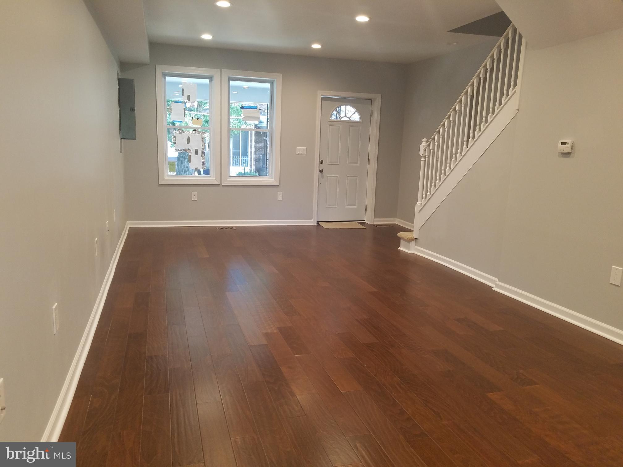 1322 Ridge Place Southeast Washington, DC 20020 - Photo 18 of 23 an empty room with wooden floor and windows