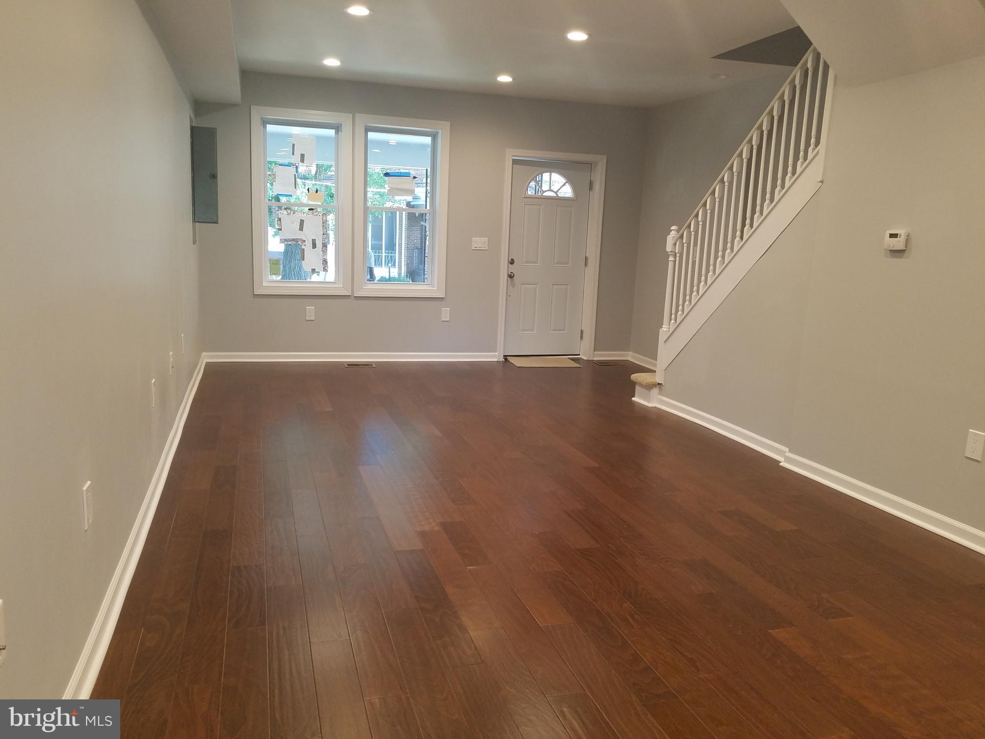 1322 Ridge Place Southeast Washington, DC 20020 - Photo 5 of 23 an empty room with wooden floor and windows