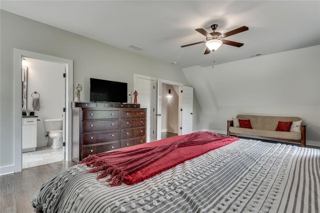 2503 Sugar Pike Road Canton, GA 30115 - Photo 102 of 134 a bedroom with a bed and a flat screen tv