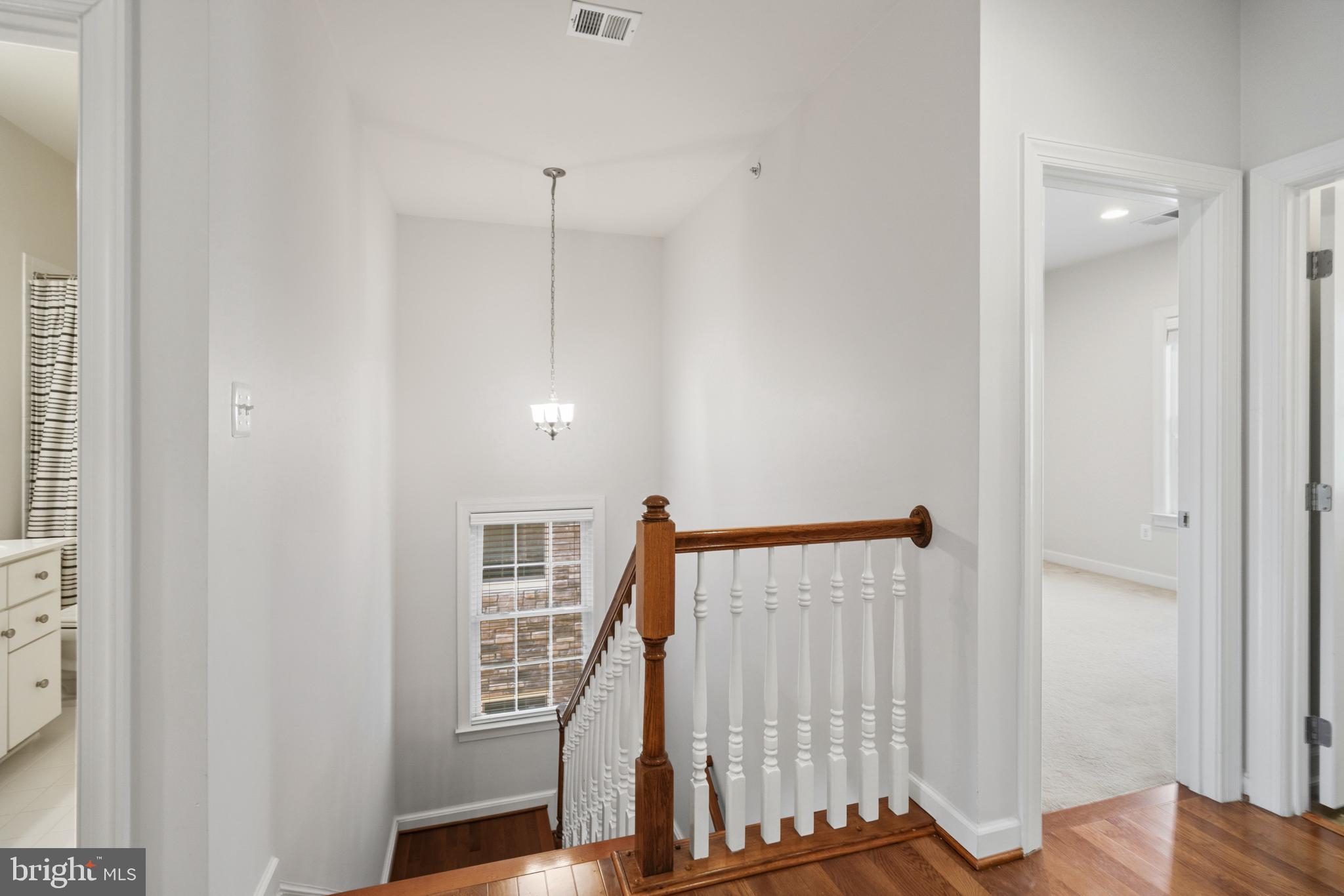 493 Watkins Mill Road Gaithersburg, MD 20878 - Photo 35 of 59 Bright and inviting staircase view.